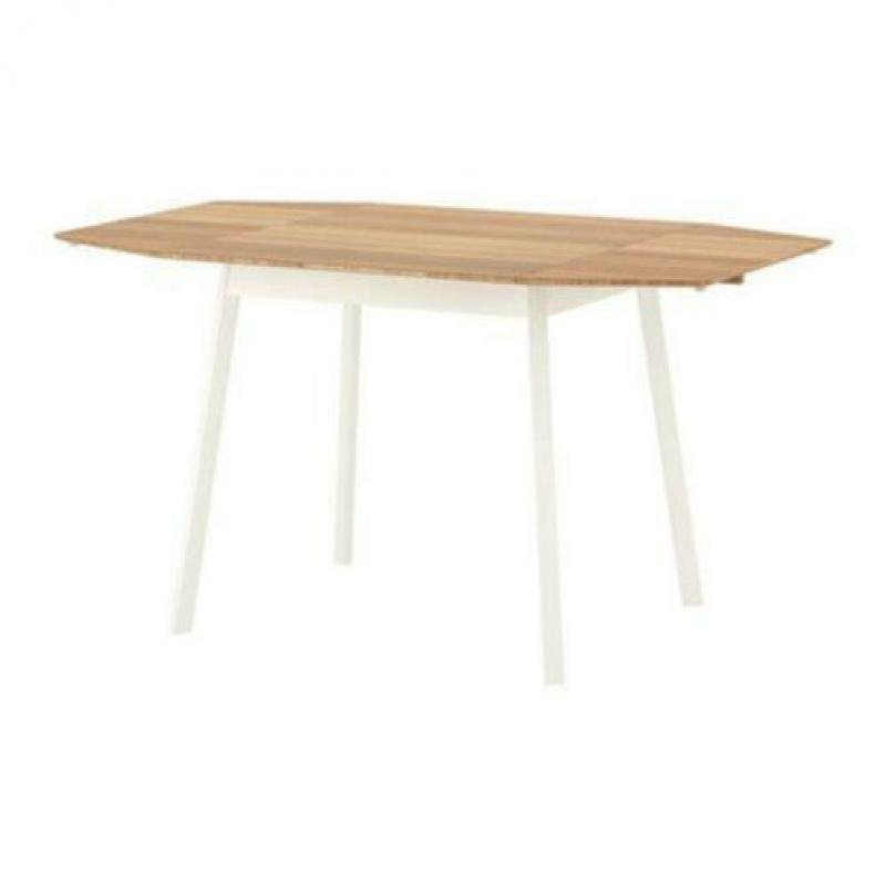 Dining table with foldable leaf