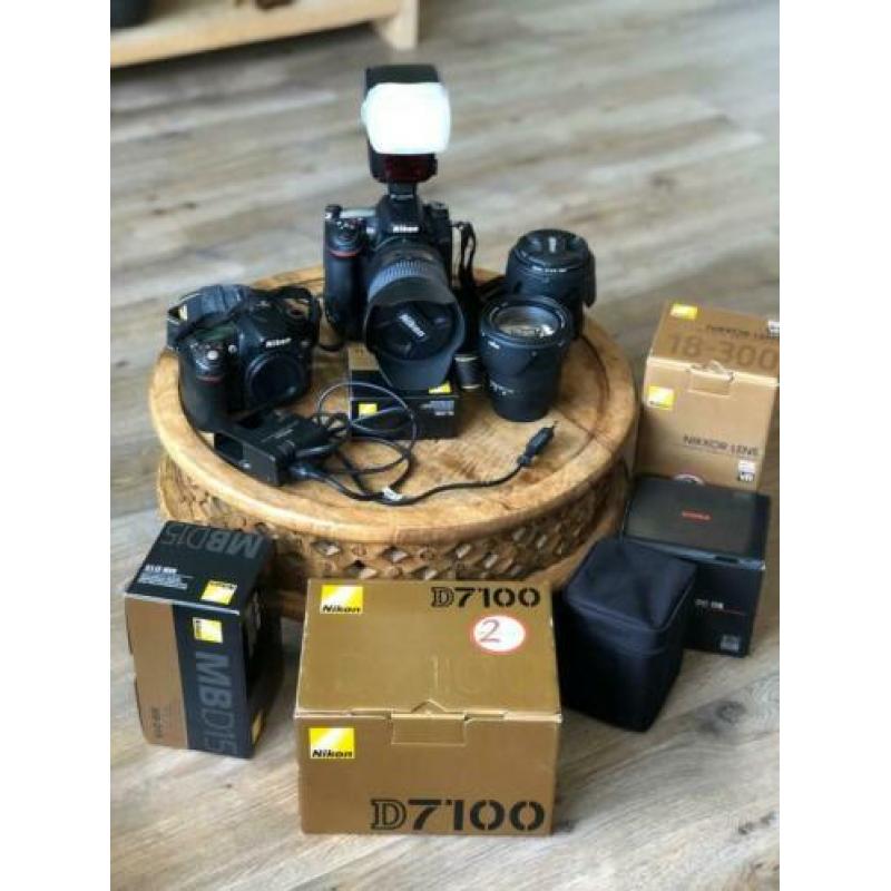 Nikon D7100 en D80 met flitser, 3 lenzen, 2 accu’s en tassen