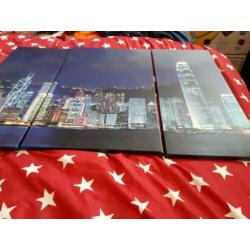 Drie luik van een skyline op canvas