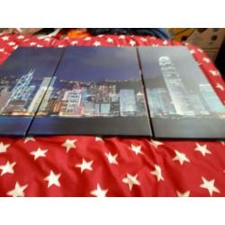 Drie luik van een skyline op canvas