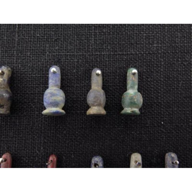 Collection of 27 Egyptian crystal poppy bead amulets