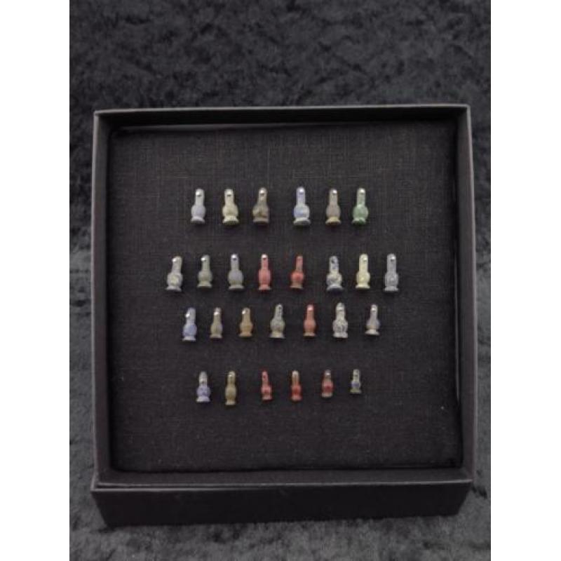 Collection of 27 Egyptian crystal poppy bead amulets